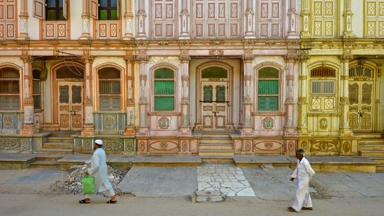 Sidhpur, Gujarat, India - September 16, 2015: Details of the 19th and early 20th century Dawoodi Bohra buildings or Bohrawads, as known locally in Sidhpur, Gujarat. Built by the Dawoodi Bohras, a Shia Muslim trading community from Gujarat. Today more than 100 such buildings exist. All differently colored but in depleted condition. As hardly anybody lives there. Most of the building lie locked. The buildings are laid in rows of narrow, deep structures, about three to four floors high. They have a strong European character with gabled roofs, ornate balconies, pilasters, columns and decorated doors and windows.