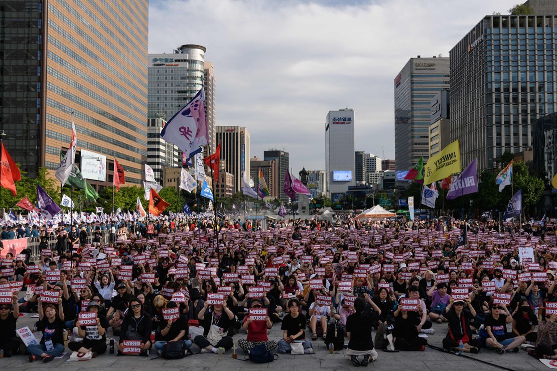 Protesters hold placards reading 'Abolish punishment for abortion' as they protest South Korean abortion laws in Gwanghwamun plaza in Seoul on July 7, 2018.