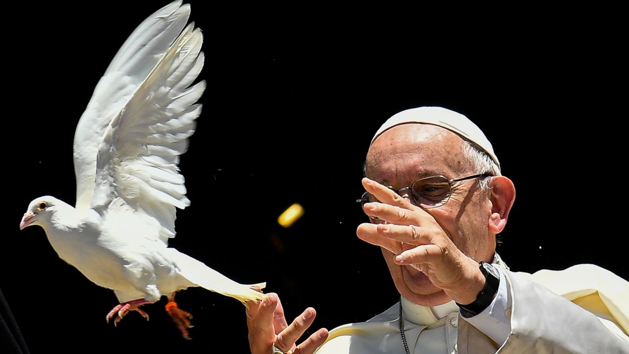 Pope Francis releases a dove after a meeting with other religious leaders at the Pontifical Basilica of St Nicholas in Bari, in the Apulia region in southern Italy, on July 7, 2018. - Pope Francis on July 7 voiced concern that Christians will disappear from the Middle East amid "murderous indifference" as war rages on. He was addressing the leaders of almost all the Middle Eastern churches gathered in the Italian port city of Bari to pray for peace in the region. (Photo by Alberto PIZZOLI / AFP) (Photo by ALBERTO PIZZOLI/AFP via Getty Images)