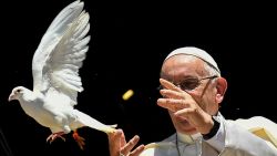 Pope Francis releases a dove after a meeting with other religious leaders at the Pontifical Basilica of St Nicholas in Bari, in the Apulia region in southern Italy, on July 7, 2018. - Pope Francis on July 7 voiced concern that Christians will disappear from the Middle East amid "murderous indifference" as war rages on. He was addressing the leaders of almost all the Middle Eastern churches gathered in the Italian port city of Bari to pray for peace in the region. (Photo by Alberto PIZZOLI / AFP) (Photo by ALBERTO PIZZOLI/AFP via Getty Images)