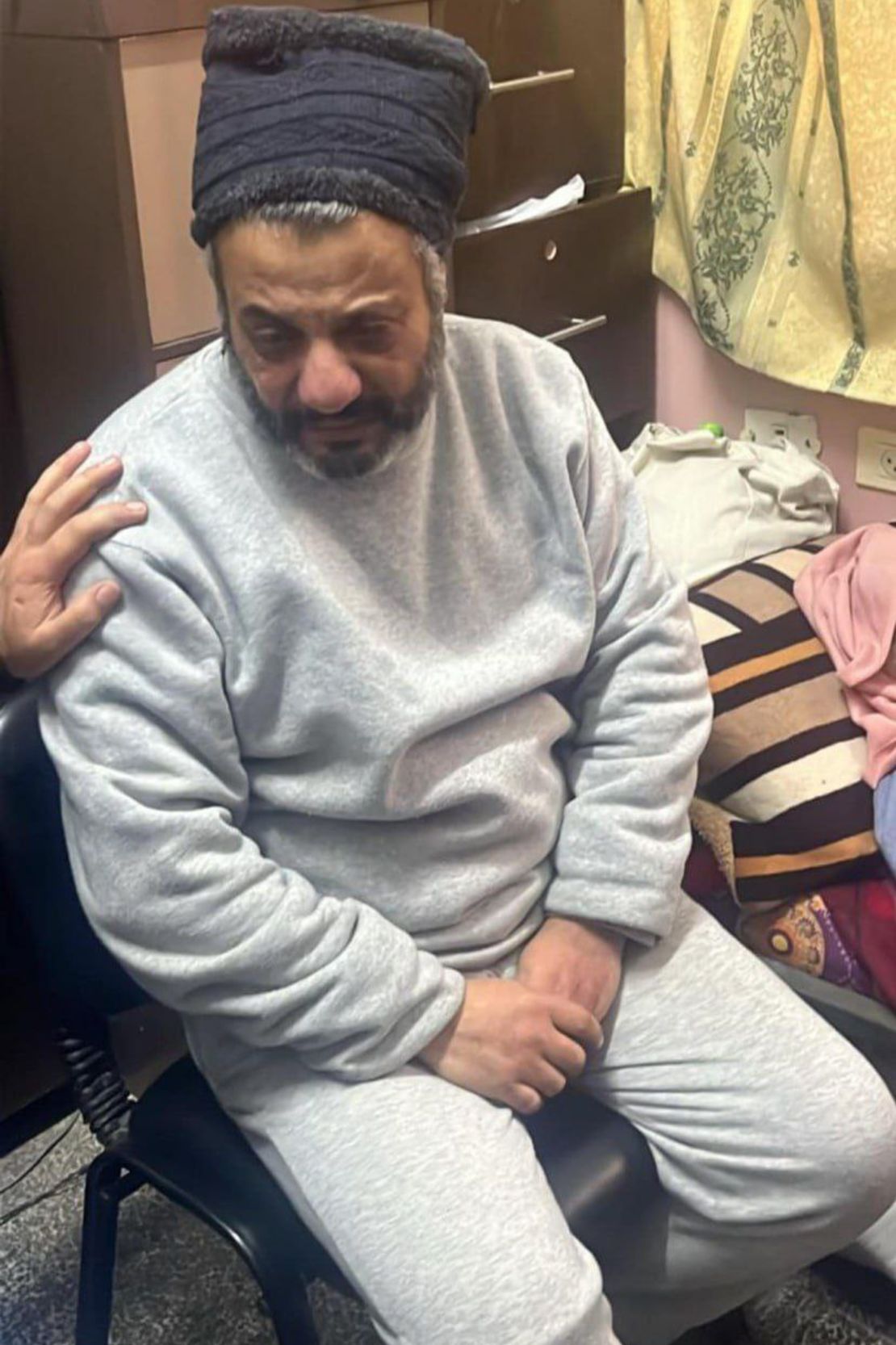 Al-Ran is pictured on the day of his release from a detention camp, in a visibly worse physical condition.