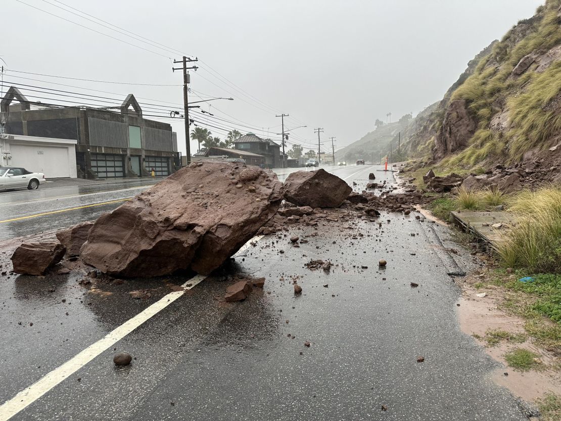 Debris blocks westbound lanes of the Pacific Coast Highway near Malibu, California, on February 19.