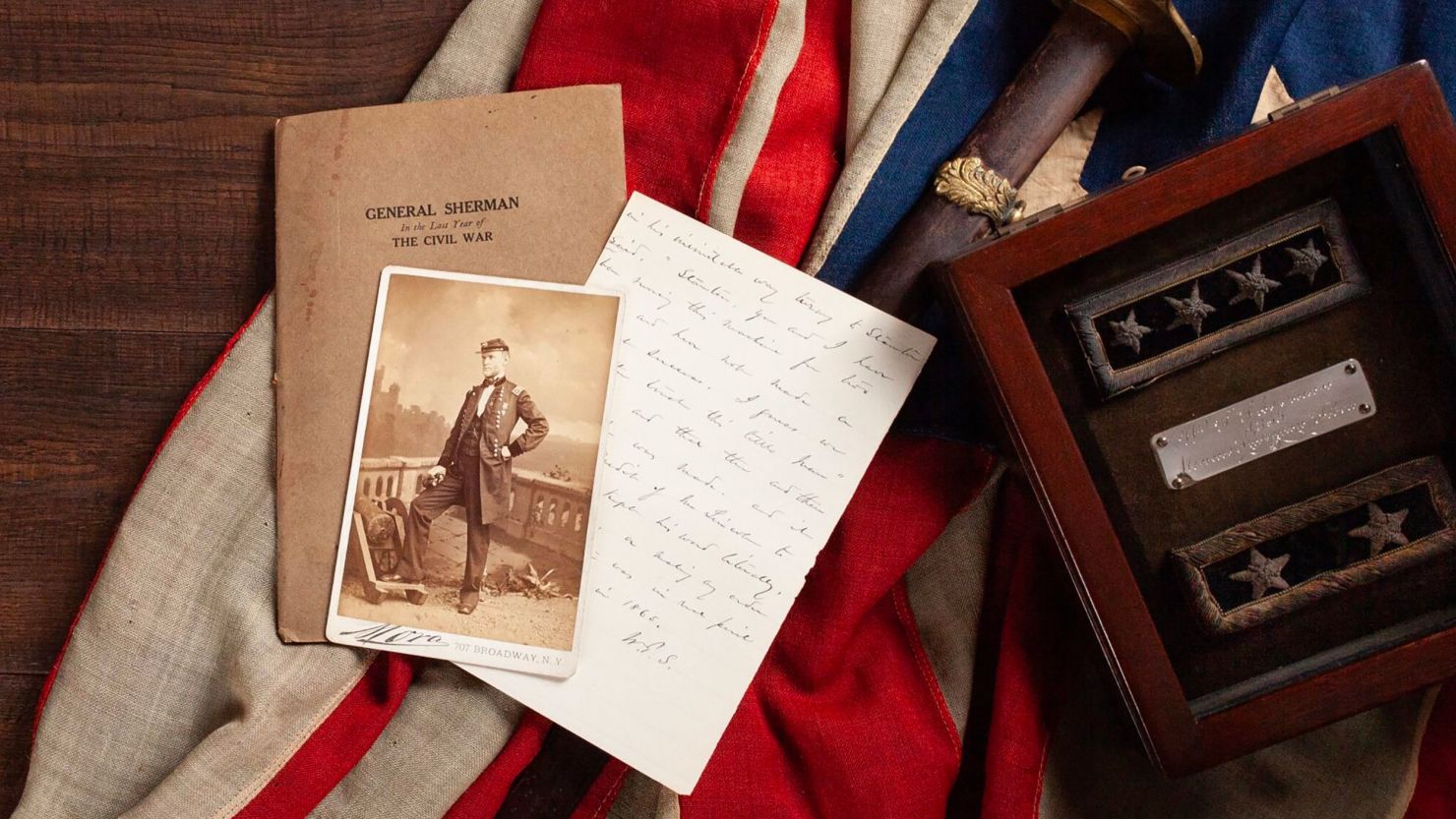 The items from William T. Sherman's family collection include his sword used in battle, rank insignia and handwritten notes by the historical figure.