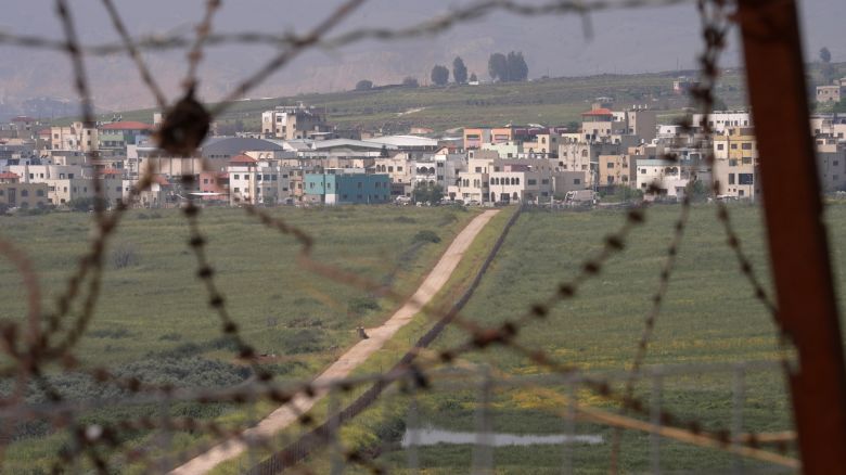 A view of the town of Ghajar taken from a Spanish UNIFIL base in Lebanon. It straddles Syrian and Lebanese territory and is occupied by Israel. A field sowed with mines buffers Lebanese-controlled territory from the Israeli-constructed fence.