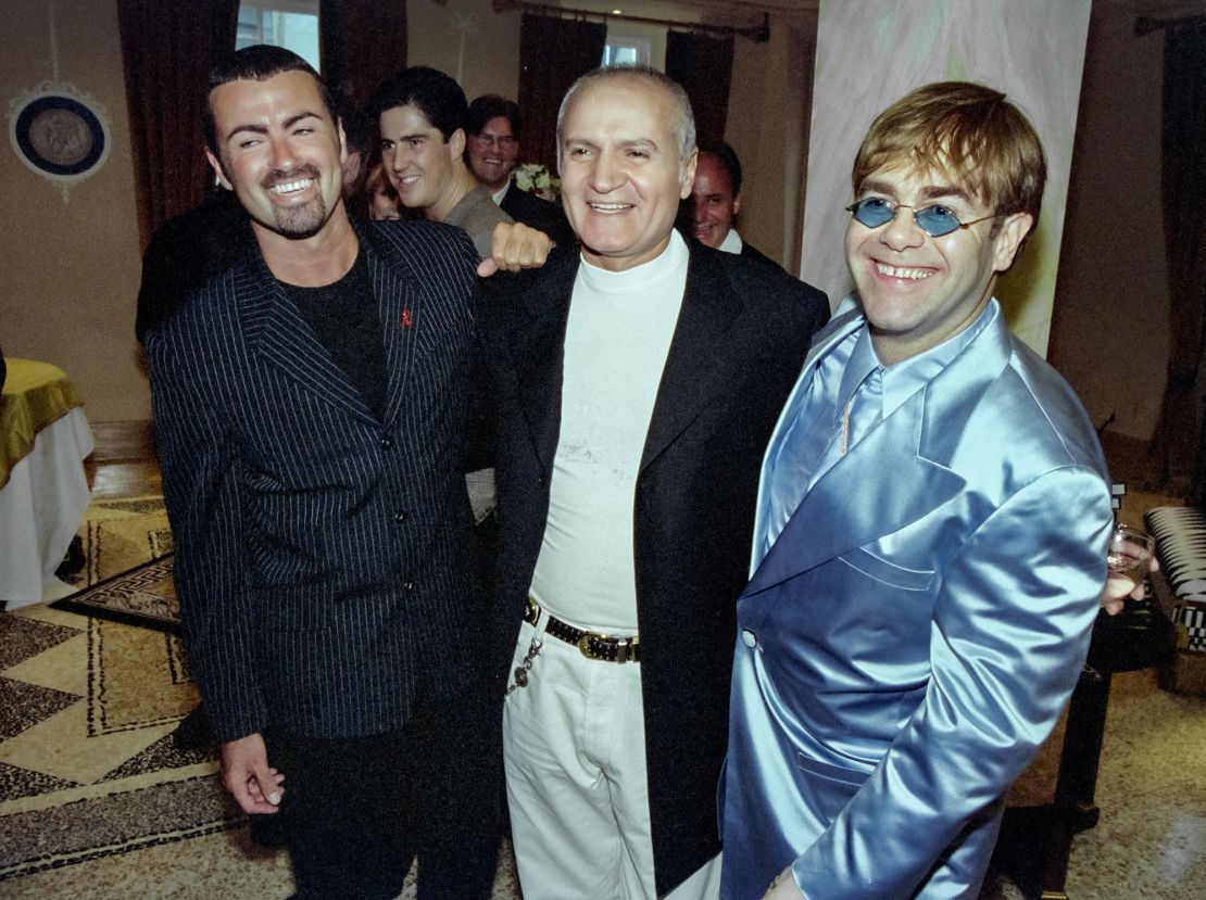 From left: George Michael with Gianni Versace and Elton John at a party to celebrate Versace's book "Men Without Ties".