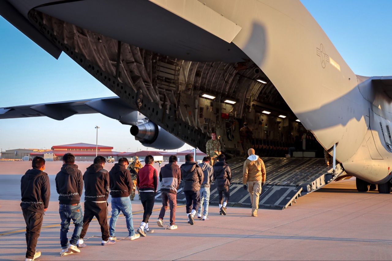 White House press secretary Karoline Leavitt shared images Friday of migrants lined up, handcuffed and boarding a military aircraft.