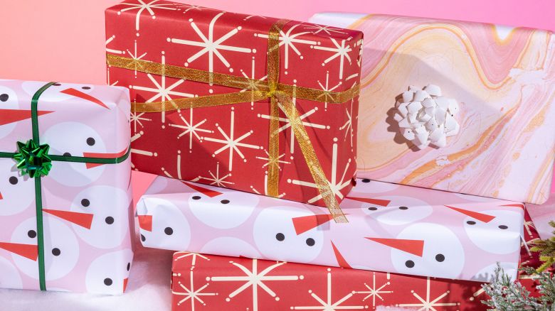 Presents gift wrapped with red, pink and white wrapping paper.