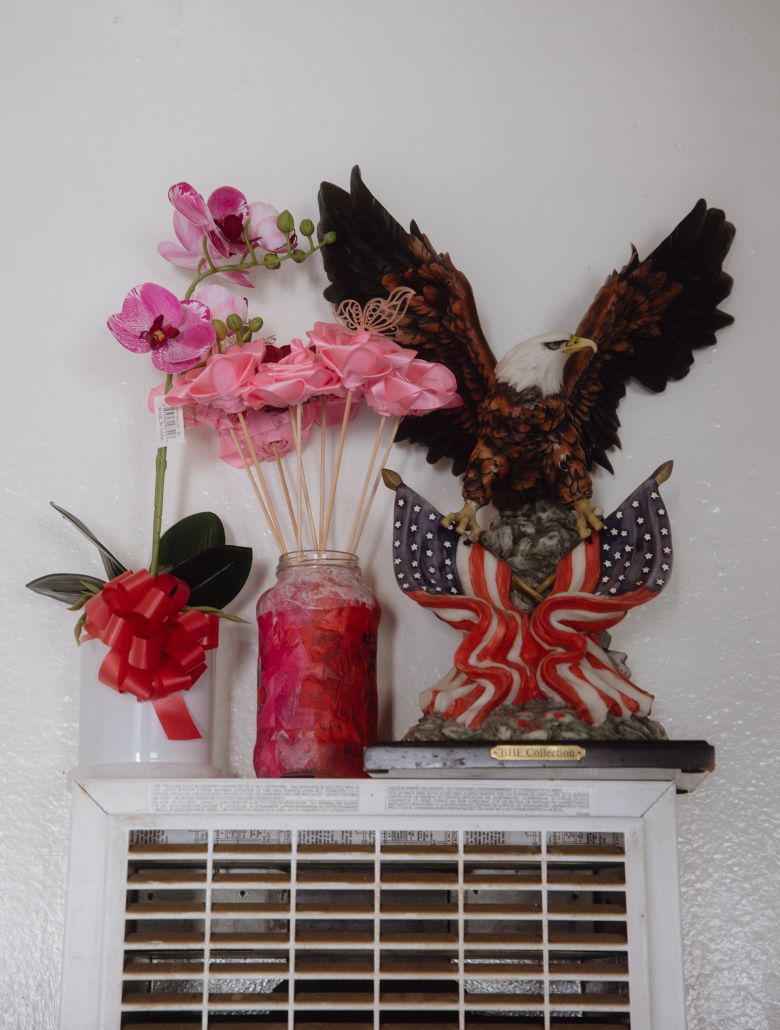 An eagle with American flags is displayed inside a family home that is sheltering children whose parents were deported.