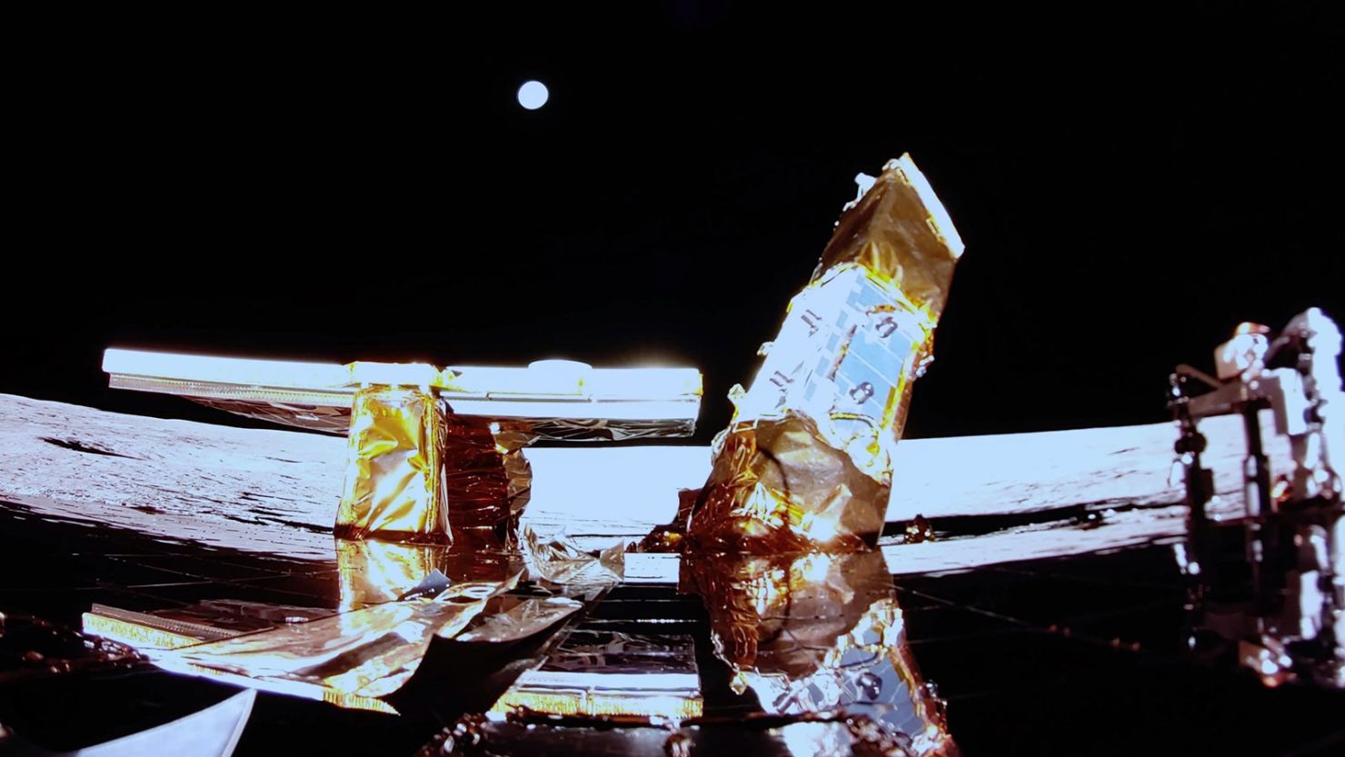 Earth is visible in the distance in this image captured by Blue Ghost following its lunar landing.