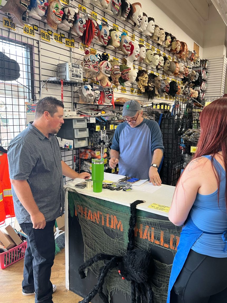 Ryan Goldman talks to his employees at Phantom Halloween in Northridge, CA. Goldman said he's trying to keep cost increases as small as possible for customers.