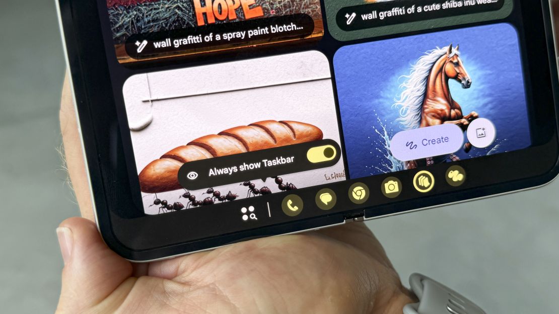 the google pixel 9 pro fold is open to a page of ai generated images, but we're close up on the "always show taskbar" menu