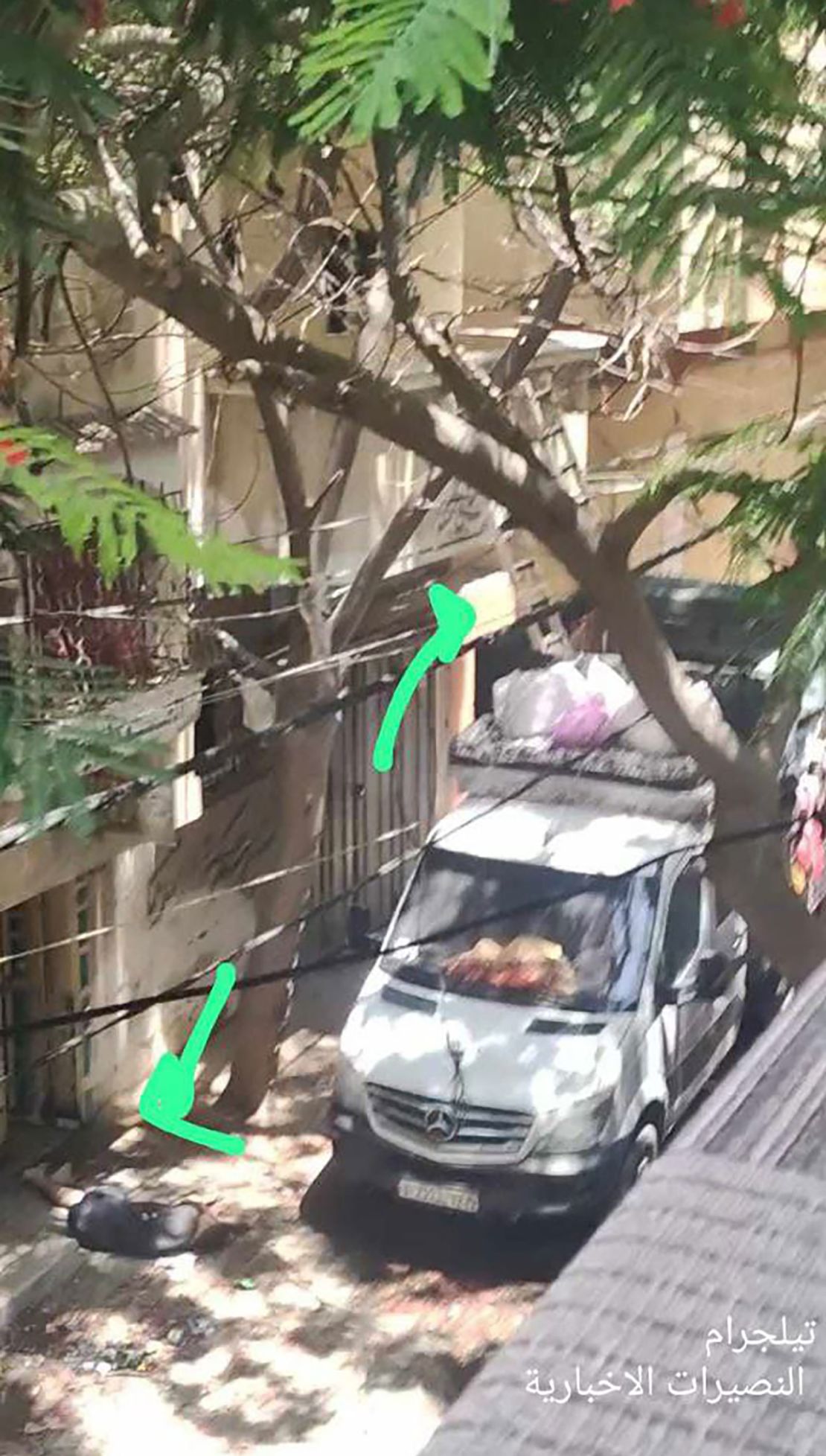 This Mercedes van, seen in an image taken from social media, was parked on a street in Nuseirat, Gaza, where the operation unfolded. Two ladders can be seen leaning up against a multistory building next to the van to reach an upper floor.