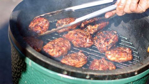 Grilling patties on the top rack of a Big Green Egg ceramic grill