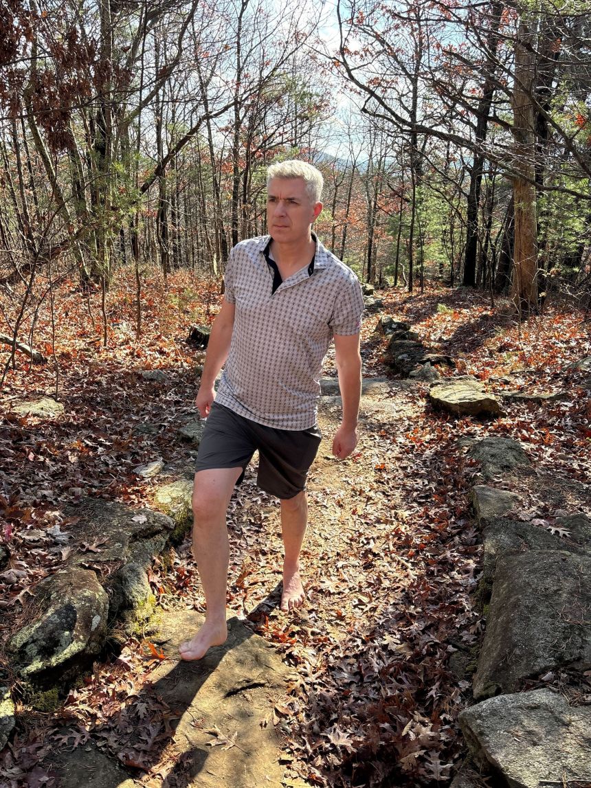 Don Riddell hikes the trails barefoot on November 23 at Leita Thompson Memorial Park in Roswell, Georgia.
