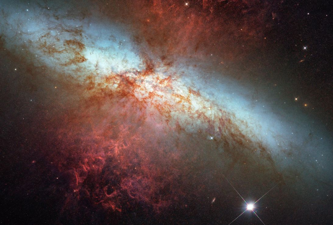 A Hubble Space Telescope composite image shows a supernova explosion designated SN 2014J in the galaxy M82.