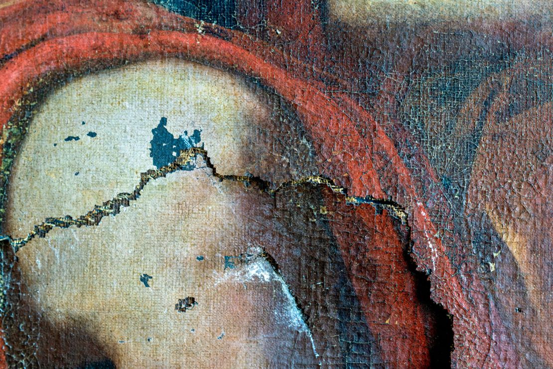 A detail of Hercules’ knee, with the longest tear in the painting.