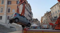 This image shared by Vigili del Fuoco, Italy’s fire and rescue service, shows a vehicle being removed after it drove down and got stuck on Rome’s Spanish Steps, on Tuesday, June 17, 2025.
