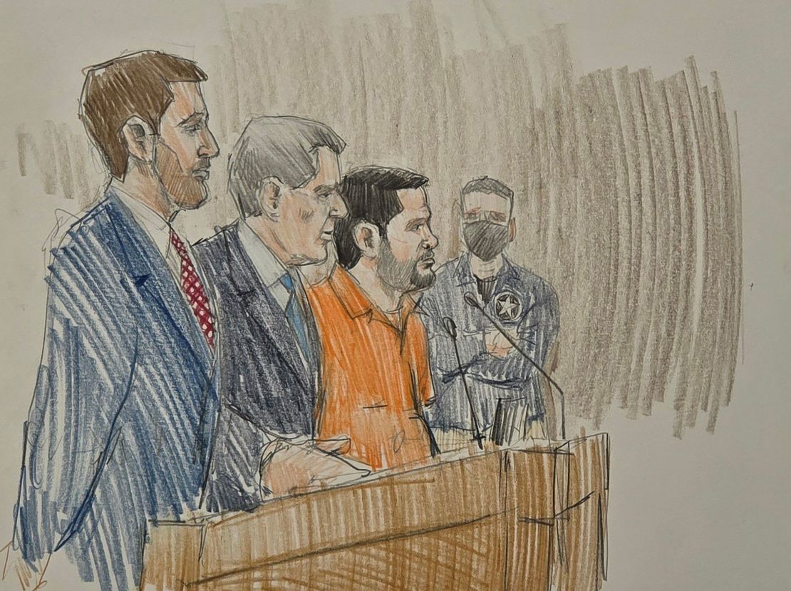 Joaquín Guzmán López, wearing an orange jumpsuit, appears in court on July 30.