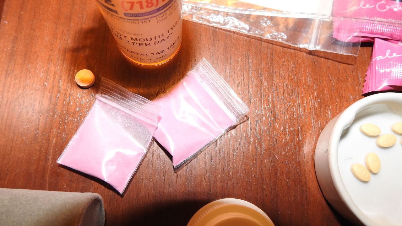 Photo evidence of a prescription bottle and pink powder discovered by investigators and shown to the jury in the Sean 'Diddy' Combs trial.