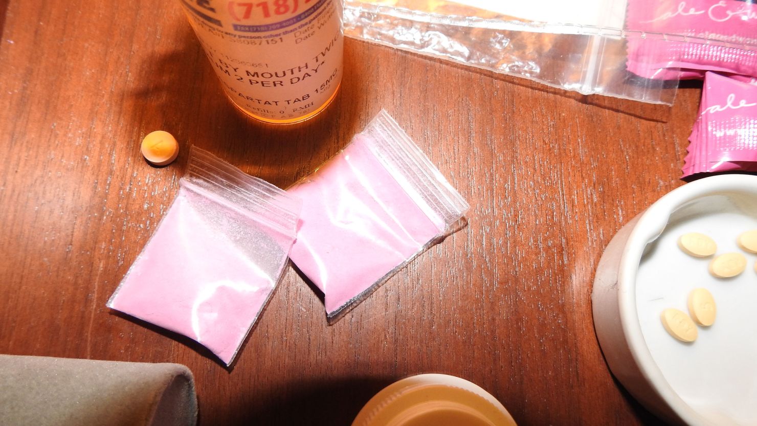Photo evidence of a prescription bottle and pink powder discovered by investigators and shown to the jury in the Sean 'Diddy' Combs trial.