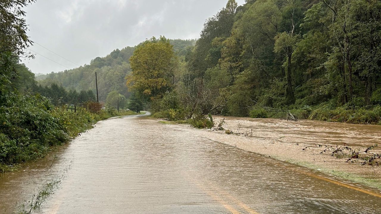 In this photo posted to X by the NCDOT, a road in western North Carolina is flooded on Friday.