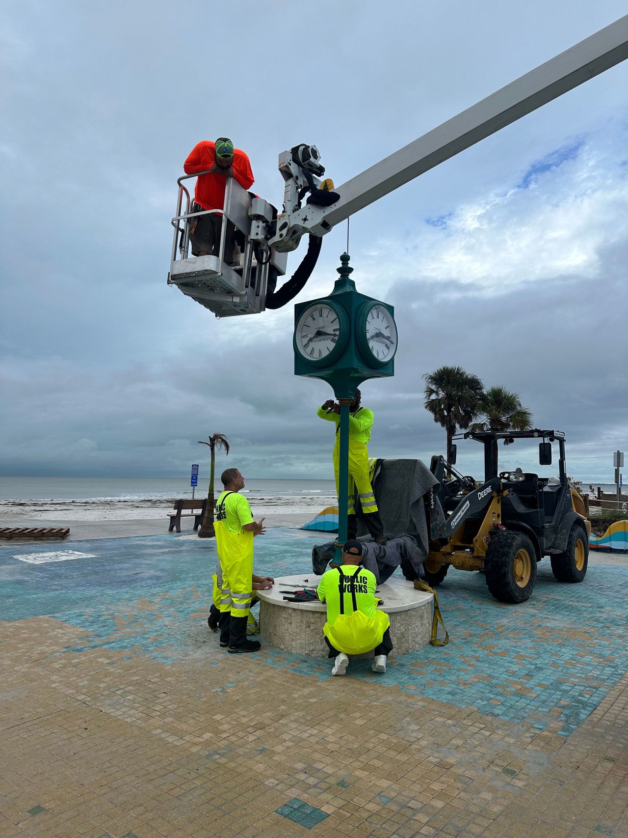 The town of Fort Myers Beach posted this photo of workers taking down the beloved Times Square clock Tuesday.