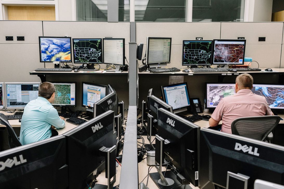Employees monitor maps and data at the Storm Prediction Center in Norman, Oklahoma, in 2019.