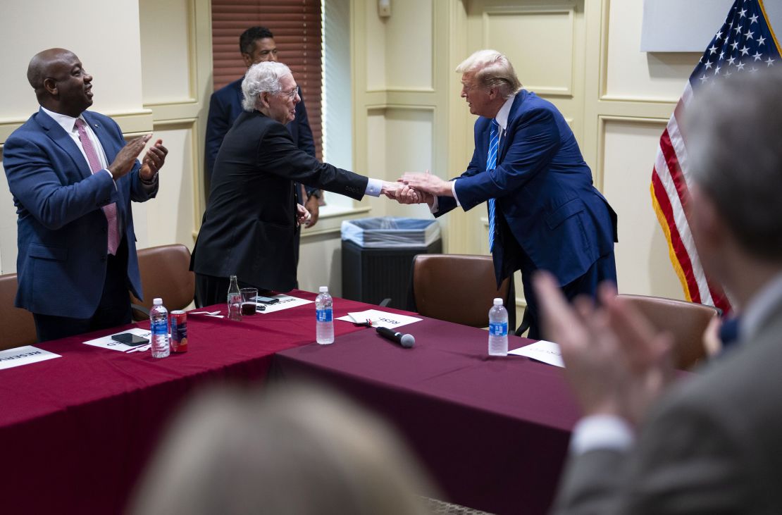 Former President Donald Trump shakes hands with Senate Minority Leader Mitch McConnell as he arrives to meet with GOP lawmakers at the National Republican Senatorial Committee headquarters in Washington on June 13, 2024.