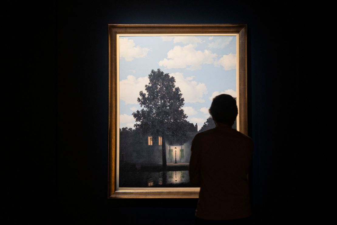 René Magritte's painting "Empire of Light" is seen during an auction preview show at Christie's in New York on November 13.