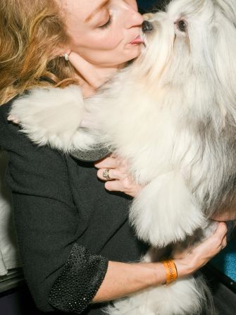 A woman and a dog are seen on Monday.