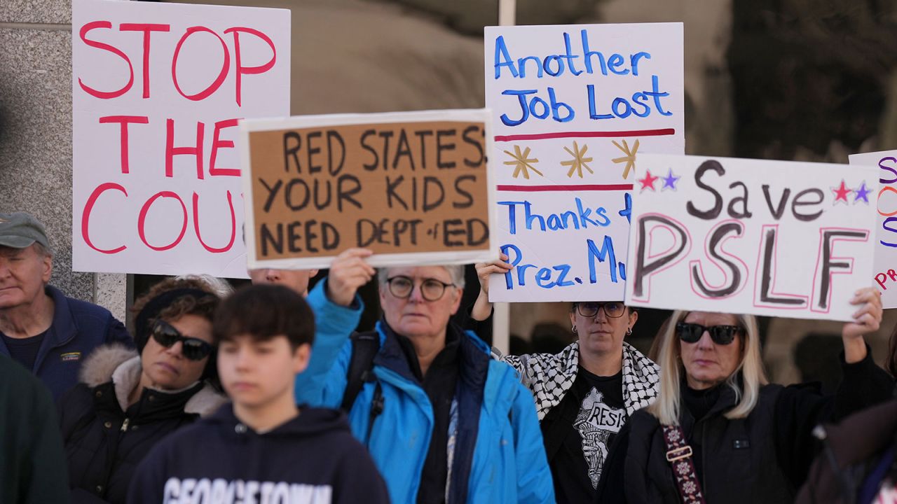 People protest President Donald Trump's plans to dismantle the Department of Education outside the agency in Washington, on Tuesday, March 11, 2025. The Education Department announced on Tuesday that it was firing more than 1,300 workers, effectively gutting the agency that manages federal loans for college, tracks student achievement and enforces civil rights laws in schools. (Eric Lee/The New York Times)