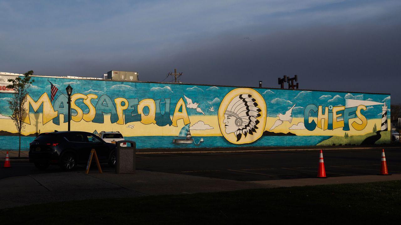 A mural of a Chief on the wall of a parking lot next to Massapequa High School in Massapequa, N.Y., April 22, 2025. President Donald Trump is weighing in on a school mascot dispute in Massapequa, where parents are upset that they have to change the Chiefs mascot and logo under a state rule. (Heather Khalifa/The New York Times)