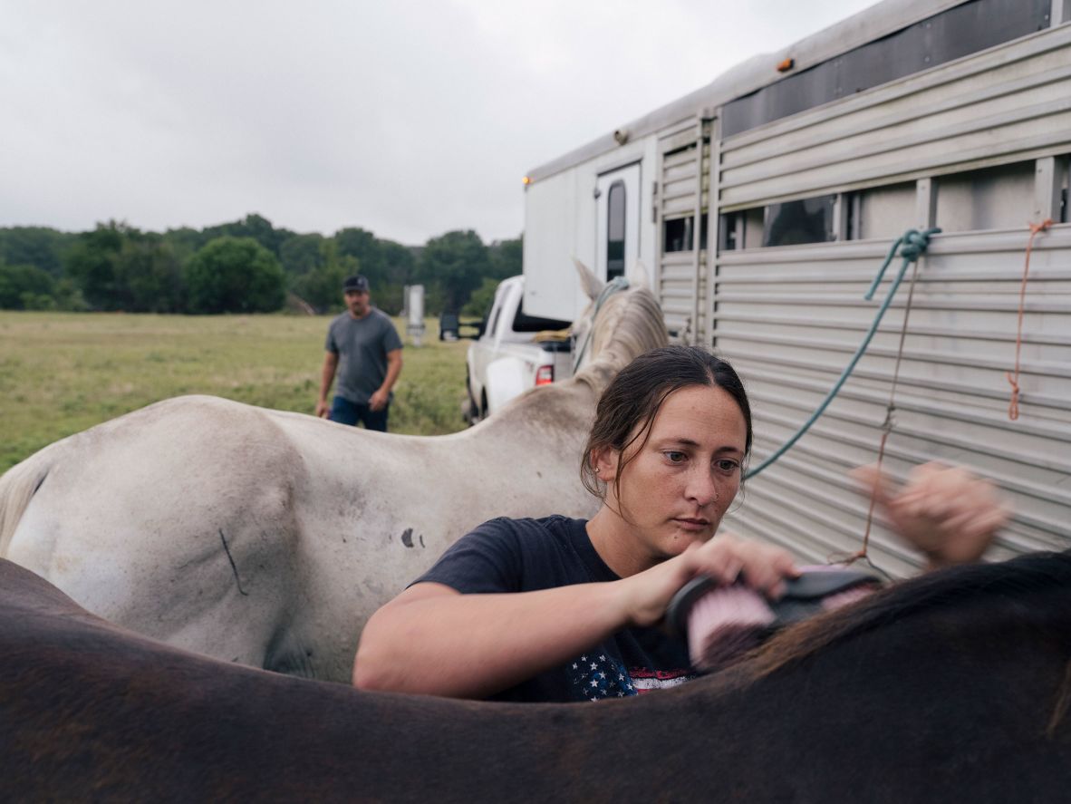 Volunteers prepare horses to join search-and-rescue crews near Ingram on Sunday.