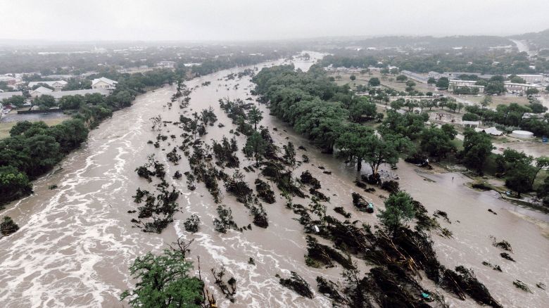 The flooded Guadalupe River in Kerrville, Texas, on Friday, July 4, 2025. When catastrophic floodwaters surged through Kerr County last week, there were no sirens or early flooding monitors -- instead, there were text alerts that came late for some residents and were dismissed or unseen by others. (Carter Johnston/The New York Times)