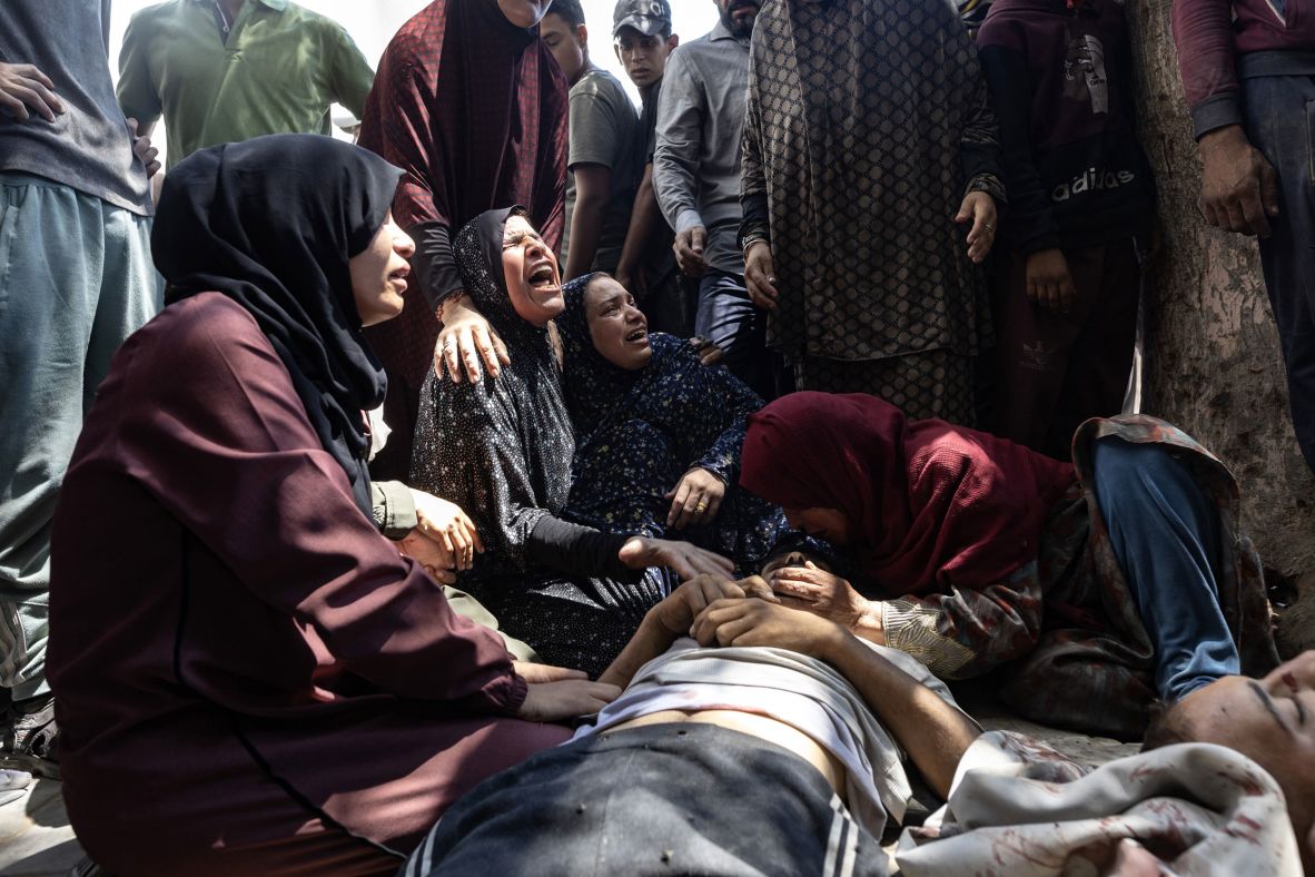 Palestinians grieve for their dead relatives outside the Al-Shifa Hospital in Gaza City on Sunday, July 20. At least 73 people were killed and around 150 people injured by Israeli gunfire in Gaza <a  target="_top" href="/newspapers?url=https://www.cnn.com/2025/07/20/middleeast/israel-gaza-aid-shooting-deaths-intl">while seeking aid on Sunday</a>, according to the Palestinian health ministry. The Israel Defense Forces said that troops had “fired warning shots in order to remove an immediate threat posed to them” after “a gathering of thousands of Gazans was identified in the northern Gaza Strip.”