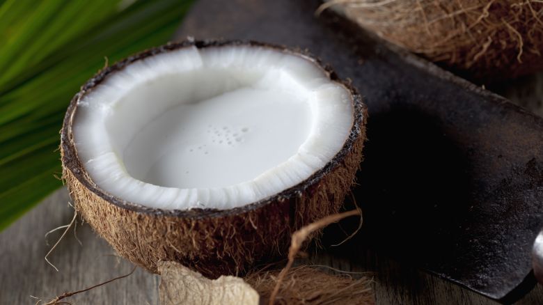 half-coconut-with-coconut-milk-inside-with-sickle.jpg