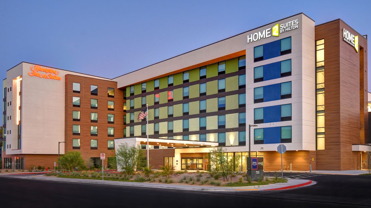 The exterior of a Hampton Inn and Home2 combined hotel in Las Vegas
