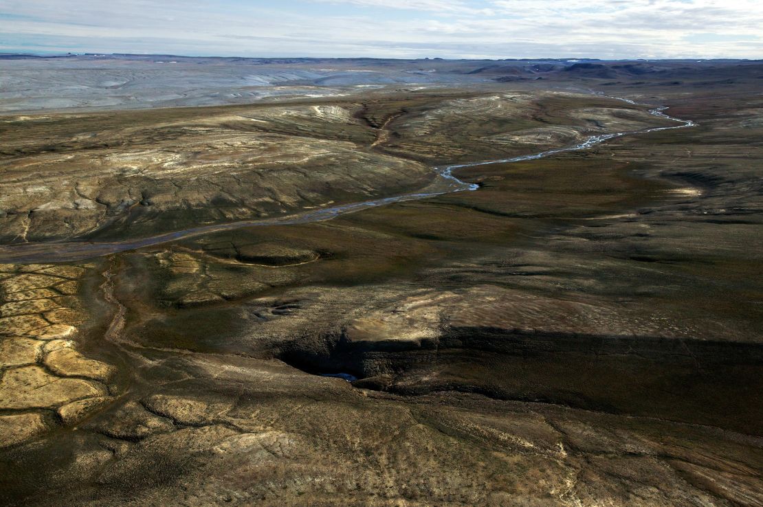 A view of the Haughton Formation near Rabbit Run creek on Devon Island, Nunavut. The dry, cold “polar desert” conditions helped preserve the ancient rhinoceros fossil found here, including traces of original proteins.