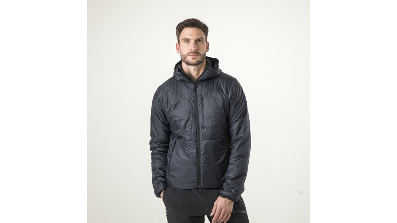 A photo of a person wearing a black HEAD Kore Lightweight Jacket