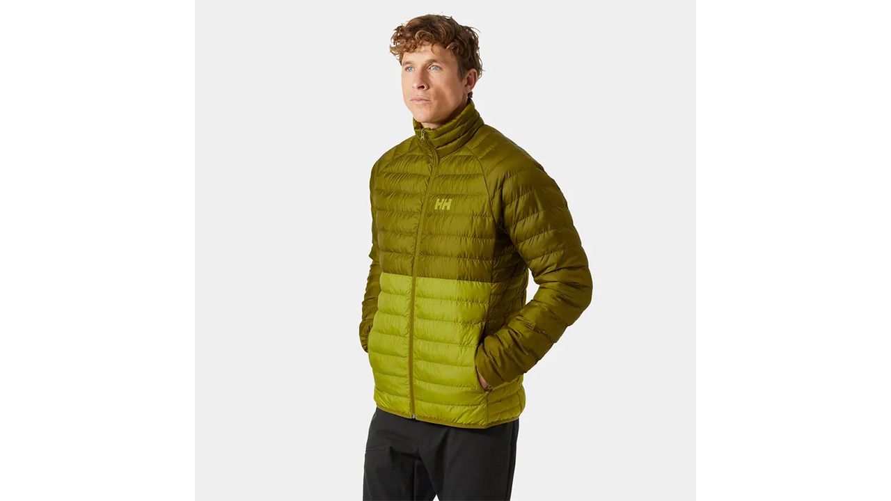 A photo of a person wearing a green Helly Hansen Men’s Banff Insulator Jacket