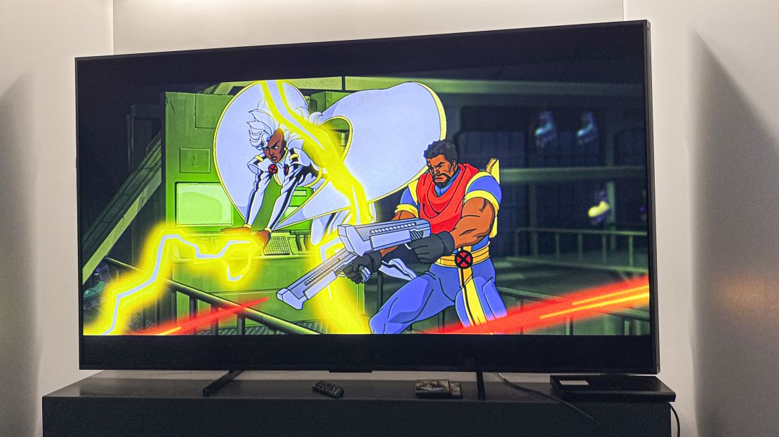 Storm and Bishop are shooting blasts off screen in "X-Men '97" on the hisense 110ux championship edition TV 