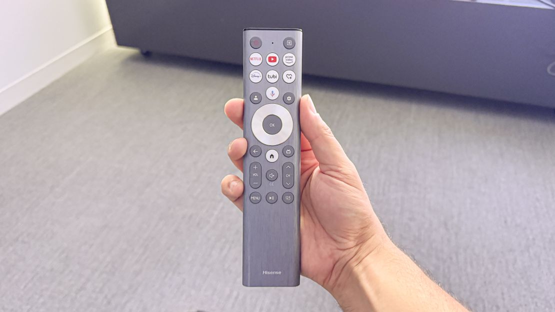 A silver remote in hand