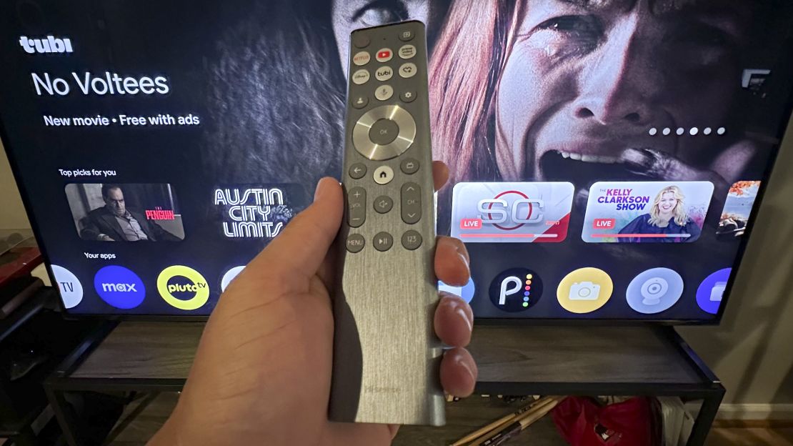 Hisense U9N remote in front of TV.