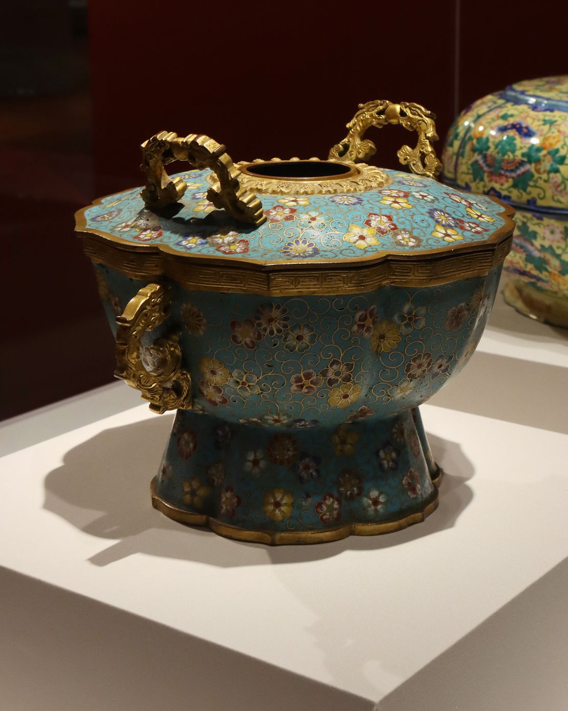 This cloisonne-lidded pot, decorated in enamels and gold, was used inside the Forbidden City.