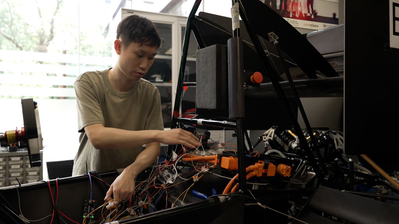 HKU race car in lab CNN.jpg