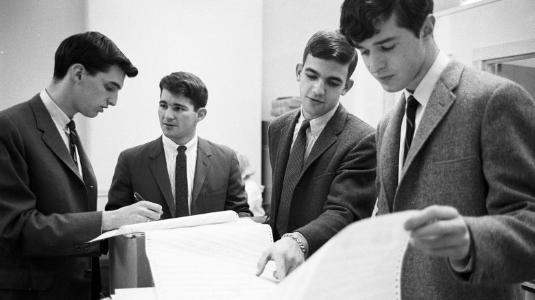 HN9D2Y Douglas Ginsburg (far left) and Jeff Tarr (second from left), of Operation Match, the first computer dating service.