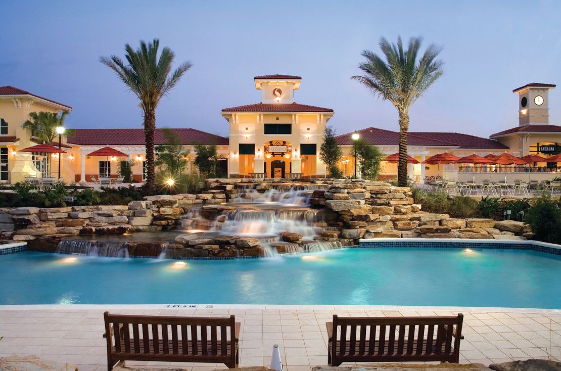 A photo of a pool and an artificial waterfall at the Holiday Inn Club Vacations at Orange Lake Resort