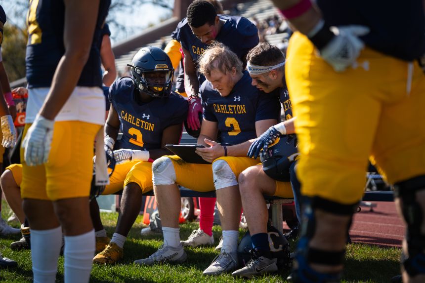 Jack Curtis gathers with his teammates on the sideline of a game earlier this season.