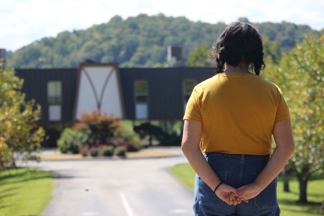 Aurora, a former Peninsula Hospital patient, looks upon the Tennessee psychiatric hospital where she was committed as a teenager. KFF Health News agreed not to publish her full name because she shared private medical history.