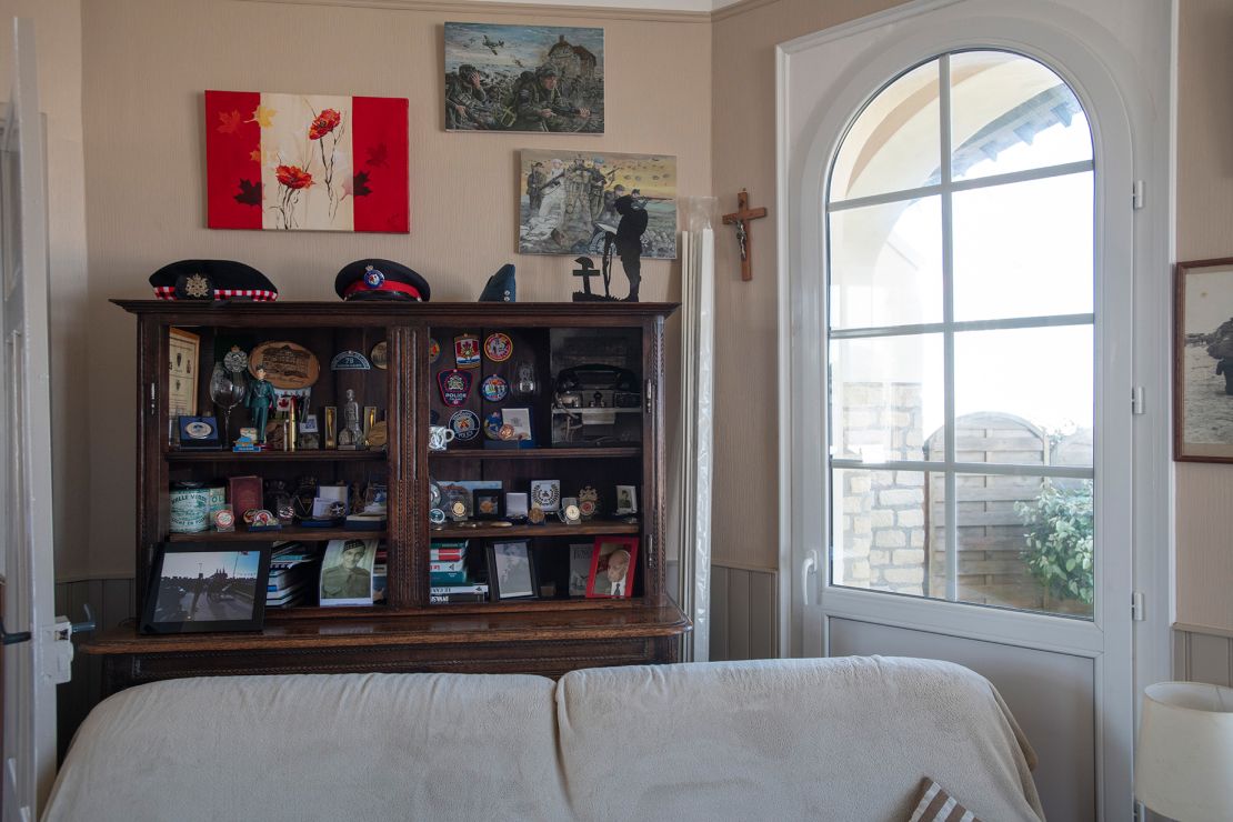 The Hoffers have collected countless souvenirs over the years, including a cross (center) that one veteran discovered during the war.